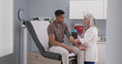 © Mark Adams - Mature female medical practitioner measuring blood pressure with monitor and stethoscope of a young male patient. Attractive black man having his blood pressure measured by senior white doctor