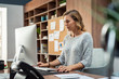 © Rido - Creative business woman using computer