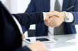 © rogerphoto - Group of business people or lawyers shaking hands finishing up a meeting , close-up. Success at negotiation and handshake concepts
