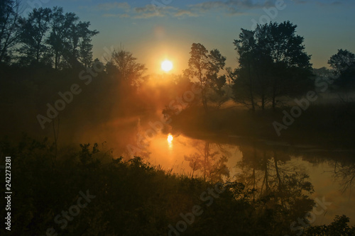 Fotografering amazing morning landscape with sunrise and fog on the river with forest around