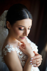 Beautiful young girl bride in a white wedding dress