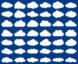 Cloud shape. Vector set of clouds silhouettes isolated on blue sky background.