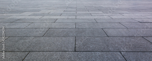 Fotografía Grey brick stone street road. Light sidewalk, pavement texture