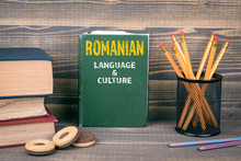 Romanian Language And Culture Concept. Book On A Wooden Background