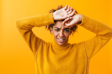 Wall Mural - Shocked young african woman wearing sweater