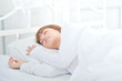 © Siriluk - On the bed in the white room.Beautiful woman sleeping in the bedroom.Asian girl sleep well.Sleeping in a white room makes you feel comfortable.Warm tone.