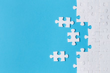 White Puzzle Pieces On Blue Background