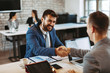© djile - Two business men make a deal and shake hands