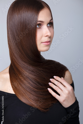 Beautiful Young Brunette Woman With Long Straight Hair Posing At
