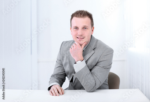 Successful Businessman Sitting Behind A Desk Buy This Stock