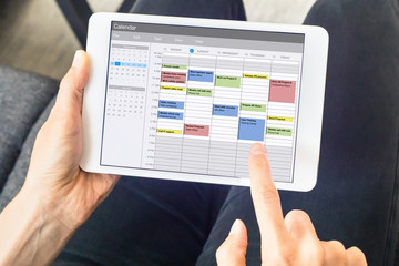 calendar app on tablet computer with planning of the week with appointments, events, tasks, and meet