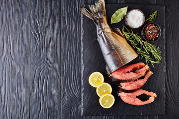 Poster - wild salmon cut in steaks on a tray