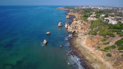 Canvas Print - Aerial. Shooting from sky of Portuguese tourist city of Lagos, overlooking dock and the beaches.