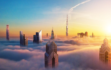 Wall Mural - Dubai sunset view of downtown covered with clouds