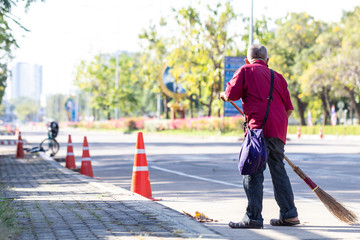 Sticker - Man cleaning garbage on the road