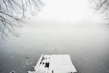 Poster - Pier on frozen winter lake in the fog