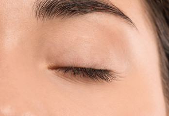 Poster - Young woman with beautiful natural eyelashes, closeup view