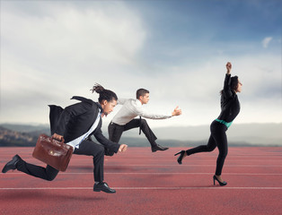 Businesswoman wins a run contest against the competitors. Concept of success