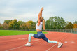 © Dmytro Flisak - Fitness woman stretching legs before run on outdoors