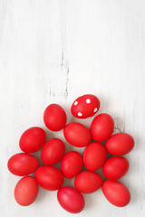 Wall Mural - Red Easter eggs on wood