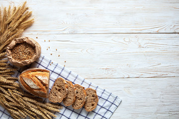 Wall Mural - Still life with bread, flour and spikelets