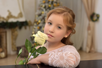 portrait of a teen blonde with a white rose