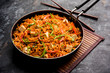 Schezwan paneer fried rice with Szechuan sauce and cottage cheese cubes. served in a bowl or plate or pan. selective focus