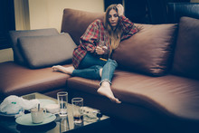 Young Drunk Woman On The Sofa. Young Drunk Woman On The Sofa. Alcoholism And Drug Addiction Lead To Depression.