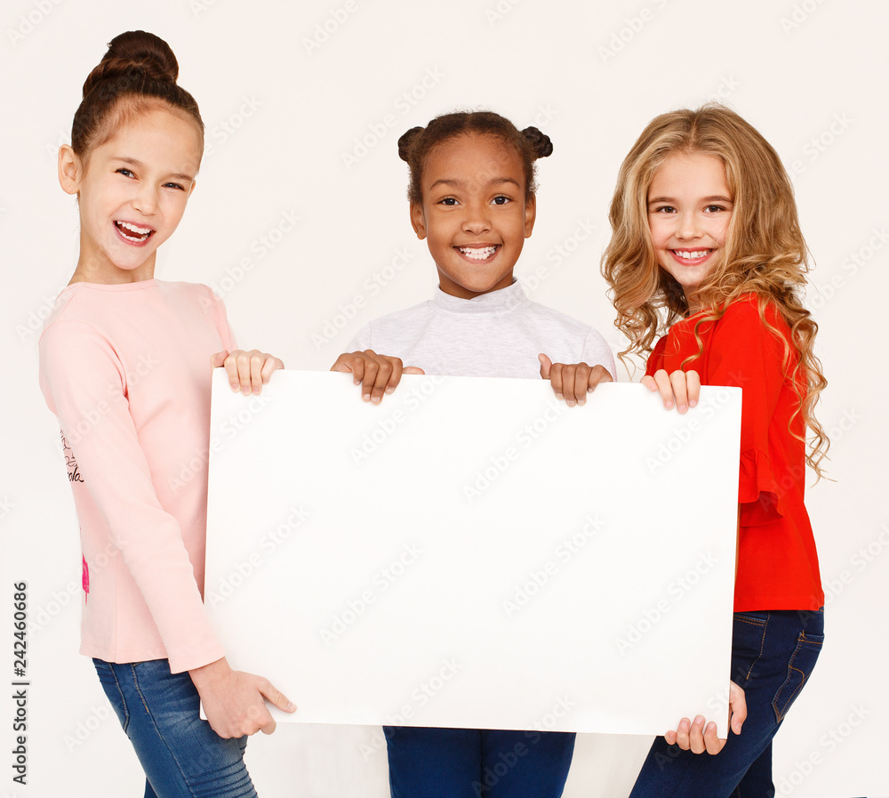 Multiracial girls holding blank banner for advertisement Stock Photo ...