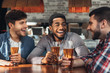 © Prostock-studio - Men drinking and talking, sitting in bar