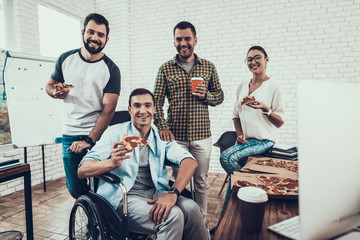 Wall Mural - Young People Have Lunch with Pizza in Office.