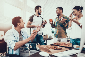 Wall Mural - Young People Have Lunch with Pizza in Office.