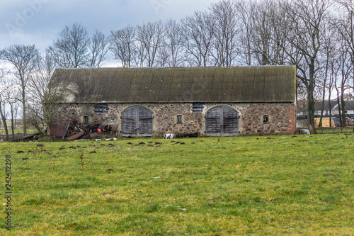 A Bit Of Snow On The Green Pasture Abandoned Stone Barn On An