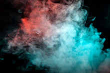 A Scattering White Cloud Of Dense Smoke, Illuminated By Different Colors And Exhaled From A Cigarette, Rolls Up In Waves, Rising To The Top Against A Black Background.
