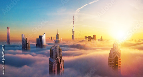 Fotografía Dubai sunset view of downtown covered with clouds