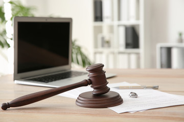 Wall Mural - Rings with decree of divorce and judge gavel on table