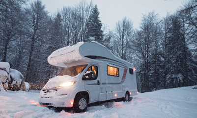 motorhome camper van in the nature, nomad van life for traveler in the winter holiday
