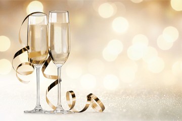 Wall Mural - Two glasses of champagne isolated on white background