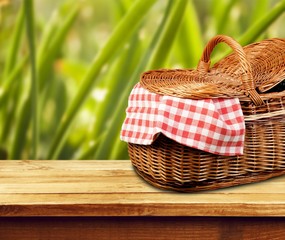 Poster - Picnic Basket with napkin on nature background