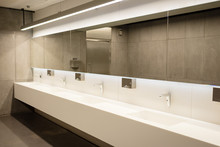 The Interior Of A Public Toilet With A Raw Design