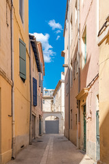 Nimes in the south of France, typical paved side street of the city center 