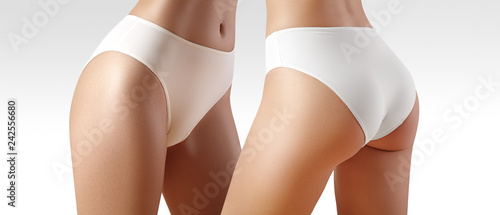 Fototapeta na szkło Spa i wellness. Zdrowe, szczupłe ciało w białych majtkach. Piękne seksowne biodra z czystą skórą. Fitness lub chirurgia plastyczna.