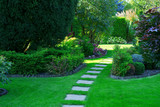 Fototapeta  - Beautiful lawn and path in a garden