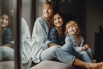 Wall Mural - Mother with daughters at home