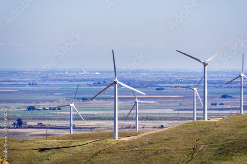 Fotografie, Obraz Wind turbines on the hills of east San Francisco bay, Stockton valley in the bac