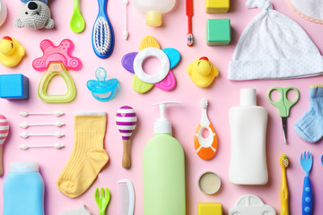 Wall Mural - flat lay composition with baby accessories and toys on color background