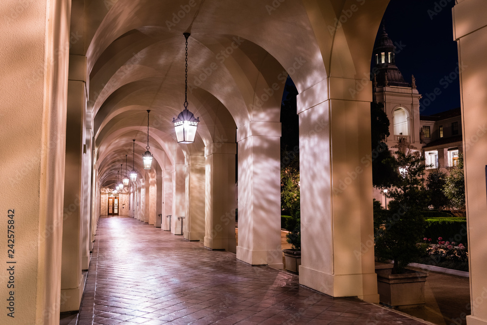 Night view of the colonnade surrounding the historical City Hall building of Pasadena, Los Angeles county, California; the building was completed in 1927; - obrazy, fototapety, plakaty 
