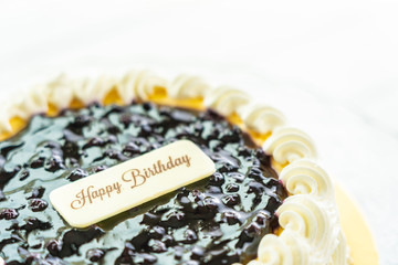 Canvas Print - Blueberry cheese cake with happy birthday sign on top