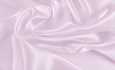 The texture of the satin fabric of lilac color for the background