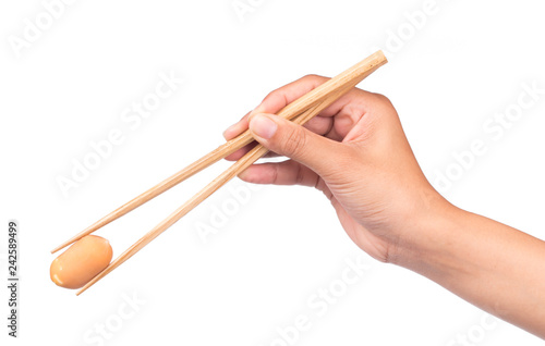 Fotografie, Obraz hand holding Sausage by chopstick isolated on white background